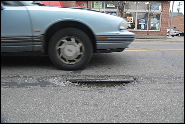 If you look close, you can see the old streetcar rail exposed on Jos. Campau near Yemans.