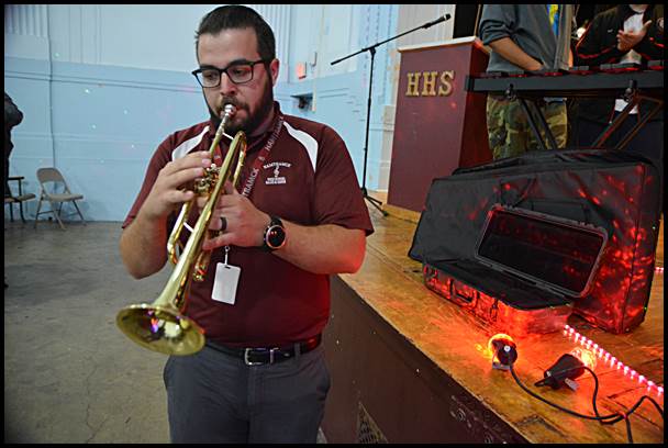 Hamtramck High School music teacher Thomas Course plays a trumpet that was one of several instruments donated to the school.
